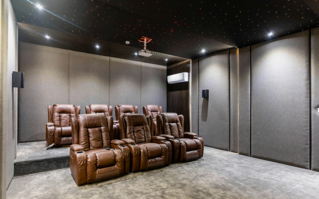Home theatre construction showing insulated walls, soundproofing materials, and structural noise isolation designed to reduce sound leakage between rooms.