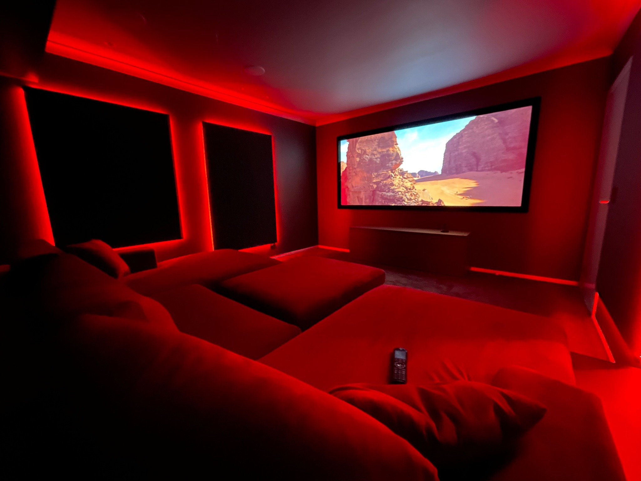 Modern residential cinema room illustrating the benefits of professional home theatre design and installation